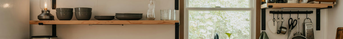 Cozy cottage kitchen with natural light and shelving