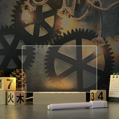 GlowNote LED message board on a wooden table at night